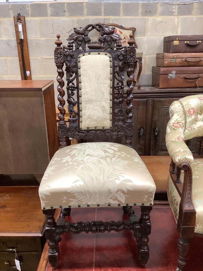 An Edwardian walnut tub chair and a vineous carved dining chair